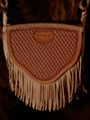 Cowgirl Cross-body Handbag by Keith Valley.  This bag is constructed with butter soft chap skin with overlaid tooling leather for the carved art.  Flowing Floral pattern on the face and a geometric stamp pattern on the back.  Handle Option either with leather strap hanger or hand braided rawhide horse bridle hanger for the shoulder strap.